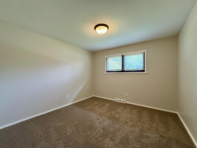 16159 Long Ave, Oak Forest, IL 60452 - unfurnished room with dark carpet and baseboards