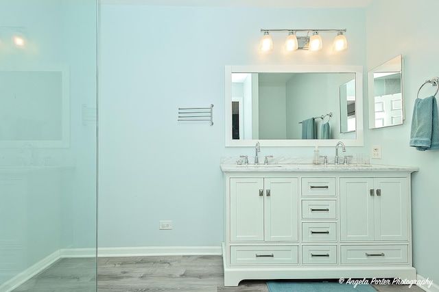 411 Lake Plumleigh Way, Algonquin, IL 60102 - bathroom with double vanity, wood finished floors, and baseboards