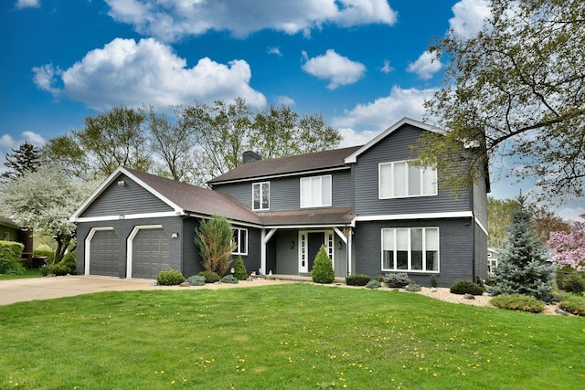 179 Old Forge Rd, Elgin, IL 60123 - traditional-style house with a garage, a chimney, a front yard, and concrete driveway