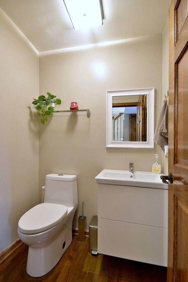 179 Old Forge Rd, Elgin, IL 60123 - half bath featuring vanity, wood finished floors, toilet, and baseboards