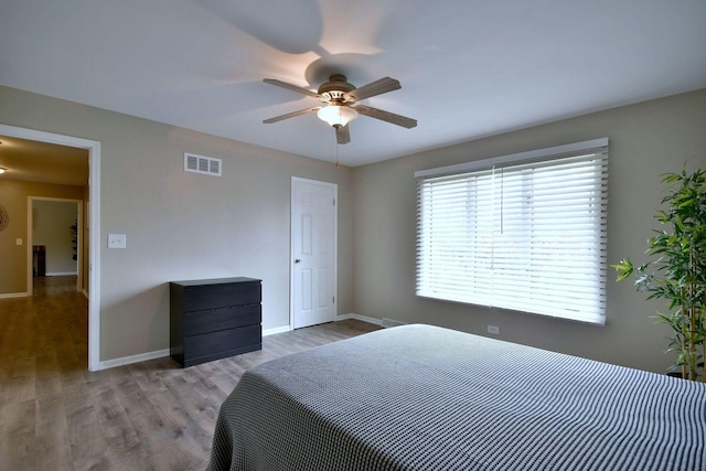179 Old Forge Rd, Elgin, IL 60123 - bedroom featuring baseboards, wood finished floors, and ceiling fan