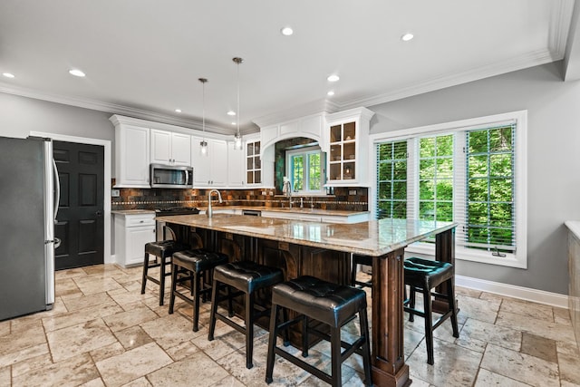 41W877 Hunters Rdg, Saint Charles, IL 60175 - kitchen with stainless steel appliances, stone tile flooring, crown molding, decorative backsplash, and white cabinets