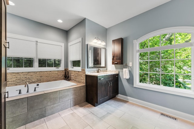 41W877 Hunters Rdg, Saint Charles, IL 60175 - bathroom featuring plenty of natural light, vanity, a garden tub, and tile patterned flooring