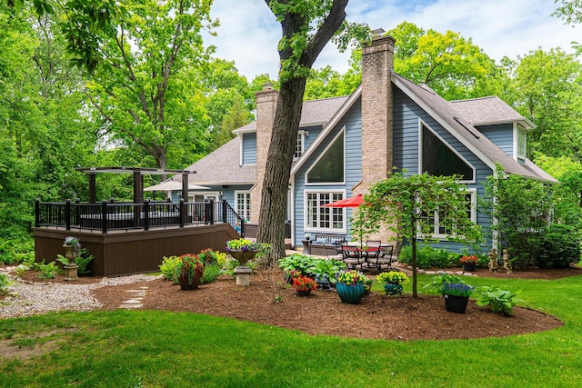 41W877 Hunters Rdg, Saint Charles, IL 60175 - rear view of property featuring a wooden deck, a chimney, a lawn, and a shingled roof