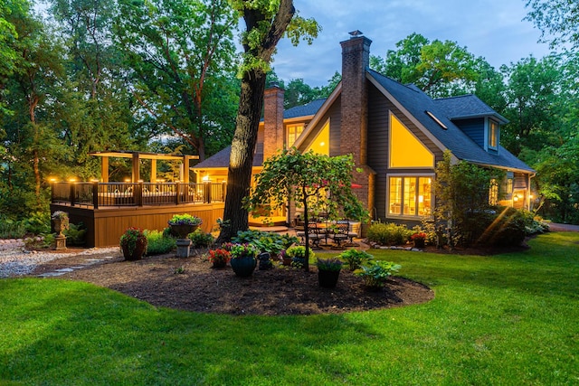 41W877 Hunters Rdg, Saint Charles, IL 60175 - back of house with a chimney, a wooden deck, a lawn, and a shingled roof