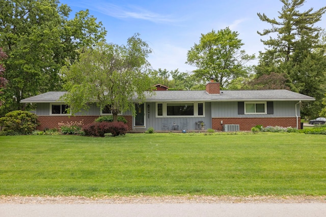 22W300 Arbor Ln, Glen Ellyn, IL 60137 - single story home with brick siding, a chimney, a front lawn, and board and batten siding
