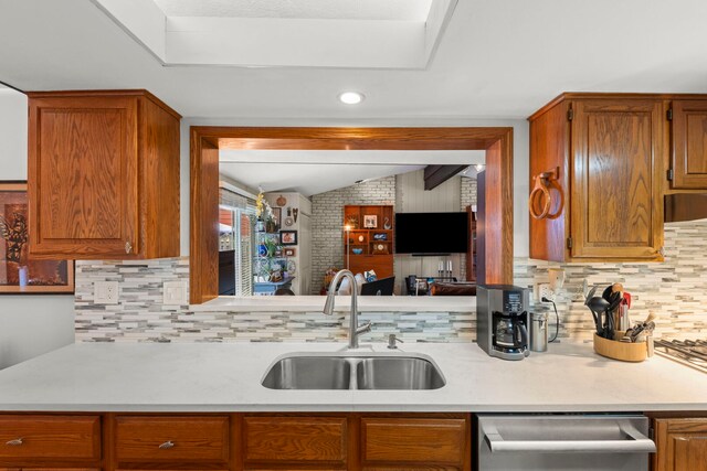 22W300 Arbor Ln, Glen Ellyn, IL 60137 - kitchen with a sink, stainless steel dishwasher, light countertops, backsplash, and lofted ceiling
