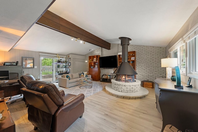 22W300 Arbor Ln, Glen Ellyn, IL 60137 - living area featuring light wood-style flooring, a wood stove, and brick wall