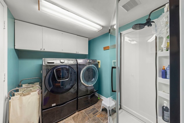 22W300 Arbor Ln, Glen Ellyn, IL 60137 - laundry room with cabinet space, washer and clothes dryer, dark stone finish floors, and baseboards