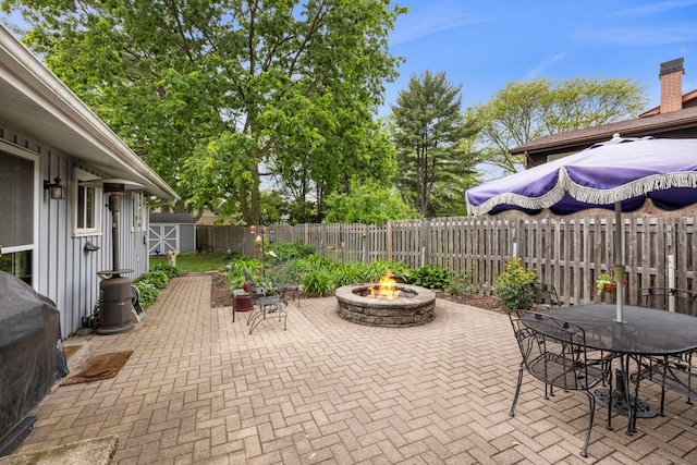 22W300 Arbor Ln, Glen Ellyn, IL 60137 - fenced backyard with a patio, an outdoor fire pit, and outdoor dining area