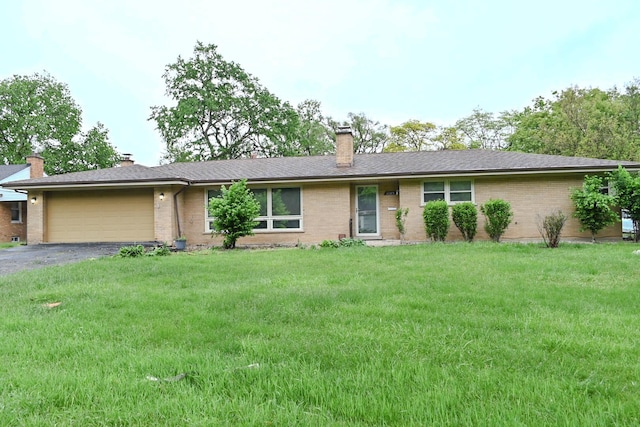 17315 Bryant Ln, Hazel Crest, IL 60429 - ranch-style house featuring brick siding, a garage, driveway, and a chimney