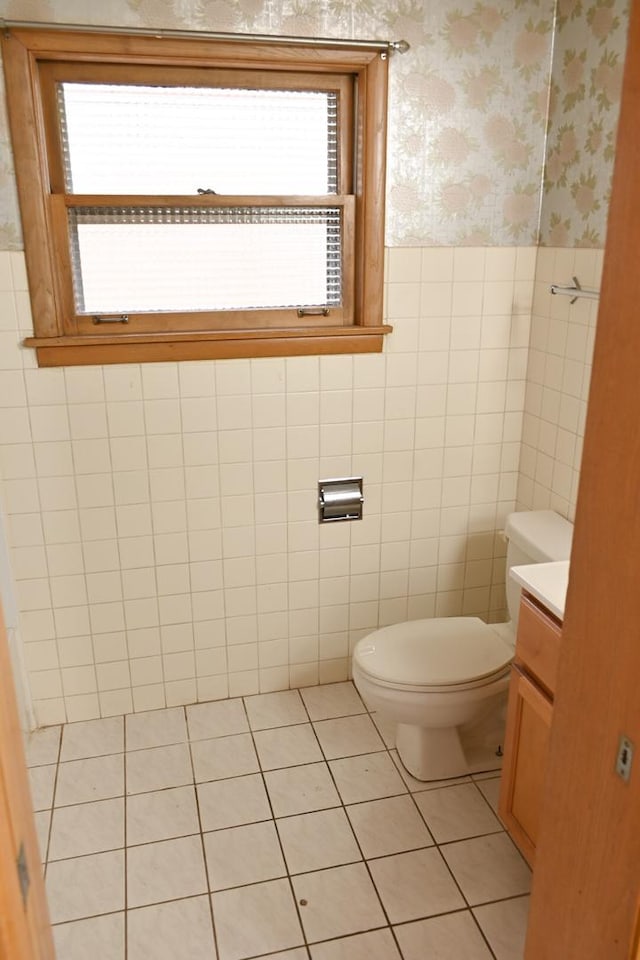 17315 Bryant Ln, Hazel Crest, IL 60429 - bathroom with wallpapered walls, toilet, tile patterned floors, vanity, and a wainscoted wall