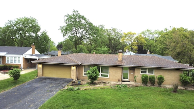 17315 Bryant Ln, Hazel Crest, IL 60429 - ranch-style home featuring brick siding, a garage, asphalt driveway, and a front lawn