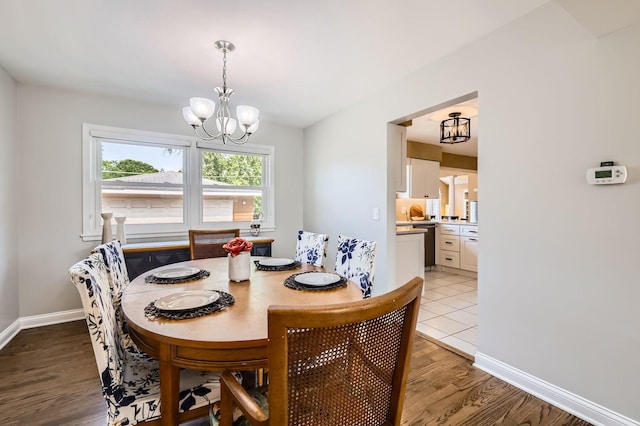 807 S Saylor Ave, Elmhurst, IL 60126 - dining space with a chandelier, light wood-style flooring, and baseboards