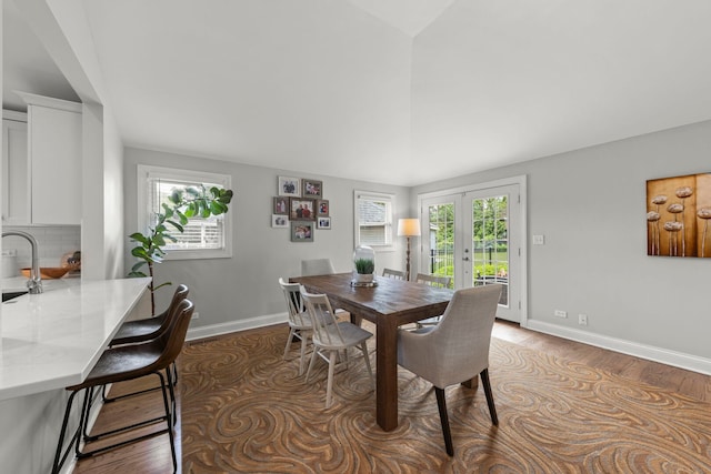 581 Summerdale Ave, Glen Ellyn, IL 60137 - dining space featuring french doors, wood finished floors, vaulted ceiling, and baseboards