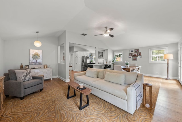 581 Summerdale Ave, Glen Ellyn, IL 60137 - living area with light wood finished floors, vaulted ceiling, ceiling fan, and baseboards