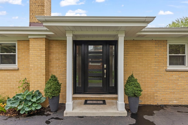 581 Summerdale Ave, Glen Ellyn, IL 60137 - doorway to property featuring a chimney and brick siding