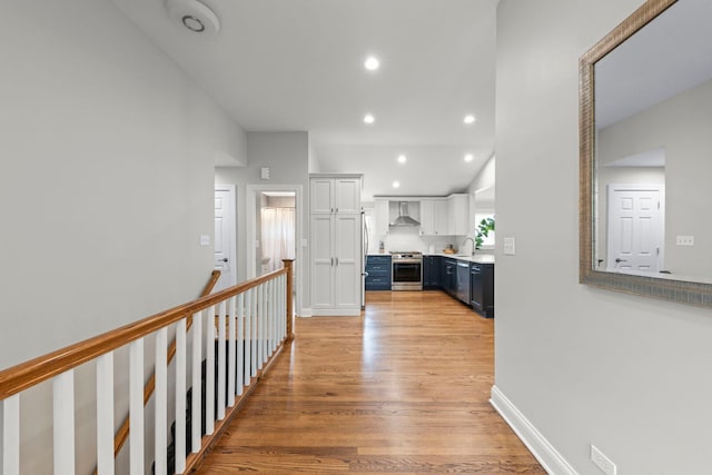 581 Summerdale Ave, Glen Ellyn, IL 60137 - kitchen with wall chimney exhaust hood, appliances with stainless steel finishes, lofted ceiling, a sink, and light countertops