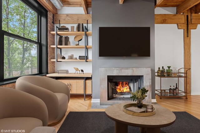 3201 N Ravenswood Ave Unit 203, Chicago, IL 60657 - living area with light wood finished floors and a fireplace with flush hearth
