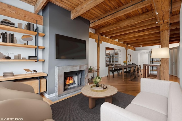 3201 N Ravenswood Ave Unit 203, Chicago, IL 60657 - living room featuring wooden ceiling with exposed beams, a high end fireplace, wood finished floors, and baseboards