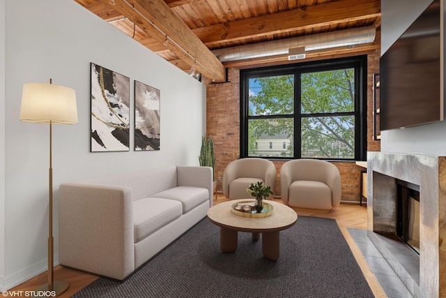 3201 N Ravenswood Ave Unit 203, Chicago, IL 60657 - living area featuring wooden ceiling with exposed beams, a high end fireplace, and wood finished floors