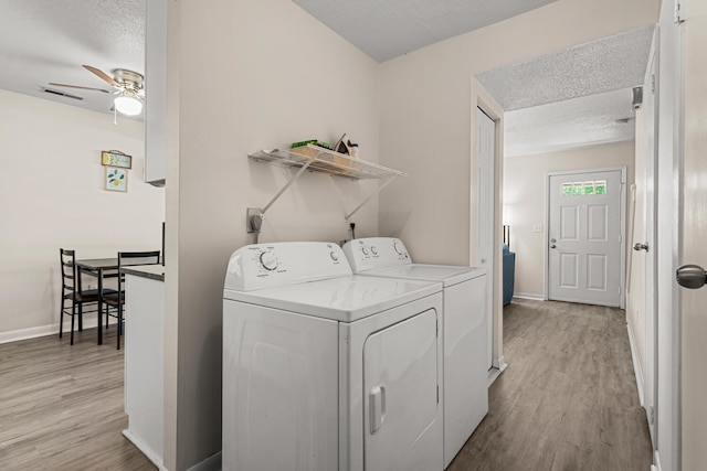 610 English Creek Ct Unit B, Champaign, IL 61821 - washroom featuring washing machine and clothes dryer, a textured ceiling, light wood-type flooring, and ceiling fan