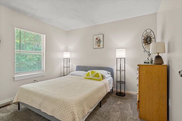 610 English Creek Ct Unit B, Champaign, IL 61821 - bedroom with dark carpet and a textured ceiling