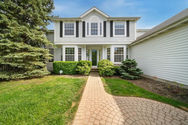 2205 Miramar Ct, Buffalo Grove, IL 60089 - colonial house featuring a front lawn