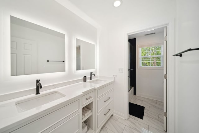 2205 Miramar Ct, Buffalo Grove, IL 60089 - bathroom with marble look tiles, double vanity, baseboards, and recessed lighting