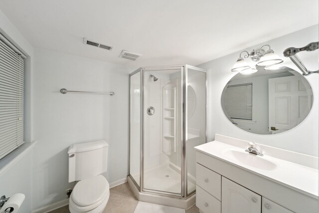 2205 Miramar Ct, Buffalo Grove, IL 60089 - full bath featuring a shower stall, vanity, toilet, and tile patterned flooring