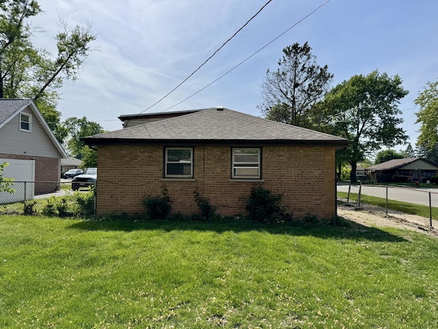 14401 Kolin Ave, Midlothian, IL 60445 - view of side of home with brick siding and a shingled roof
