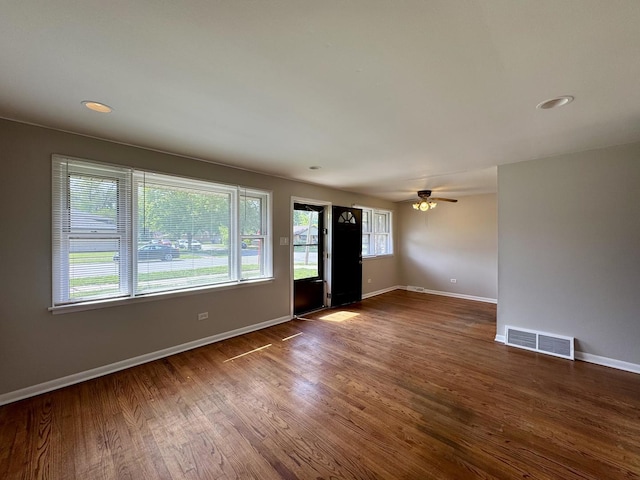 14401 Kolin Ave, Midlothian, IL 60445 - unfurnished living room with baseboards, wood finished floors, a ceiling fan, and recessed lighting