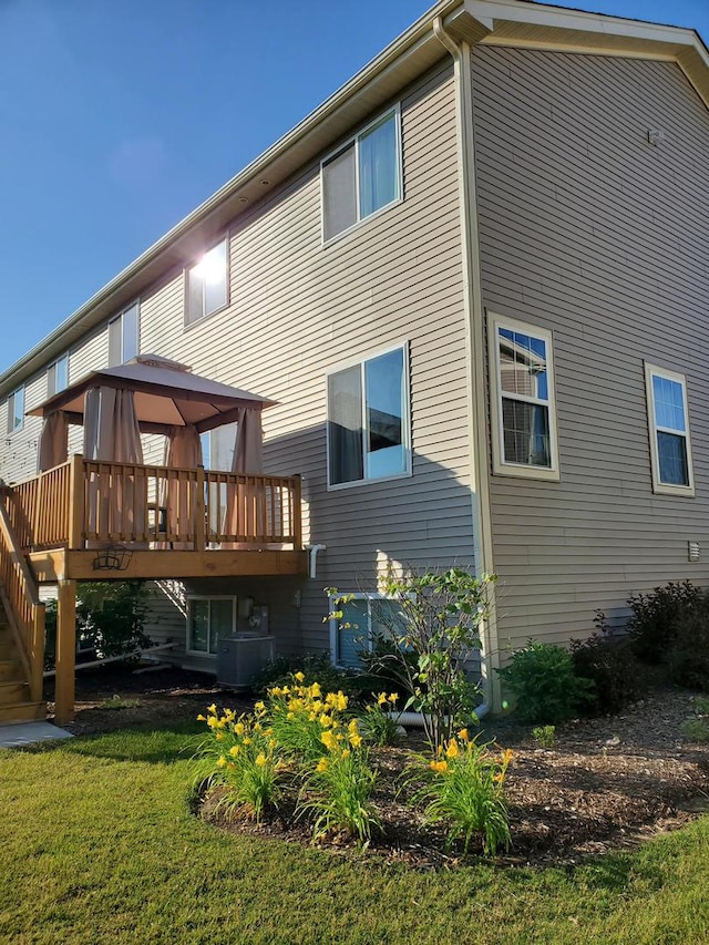 754 Westbury Dr, Cary, IL 60013 - back of property featuring a gazebo, a wooden deck, a yard, and stairs