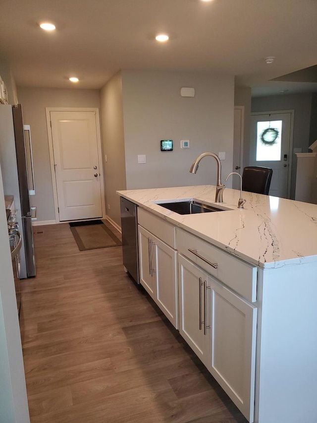 754 Westbury Dr, Cary, IL 60013 - kitchen featuring appliances with stainless steel finishes, white cabinetry, light stone counters, recessed lighting, and wood finished floors