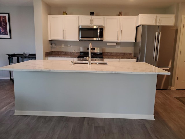 754 Westbury Dr, Cary, IL 60013 - kitchen with stainless steel appliances, white cabinetry, light stone counters, and dark wood-type flooring