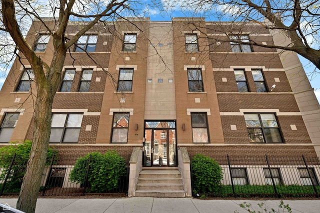 4606 S Lake Park Ave Unit 201N, Chicago, IL 60653 - view of apartment building / complex with a fenced front yard