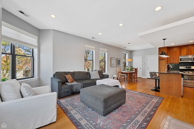 4606 S Lake Park Ave Unit 201N, Chicago, IL 60653 - living area with recessed lighting and wood finished floors