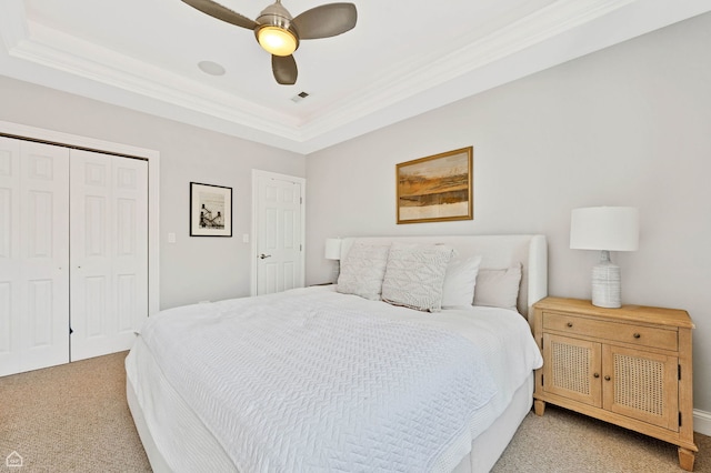 4606 S Lake Park Ave Unit 201N, Chicago, IL 60653 - bedroom with light carpet, a tray ceiling, crown molding, a closet, and a ceiling fan