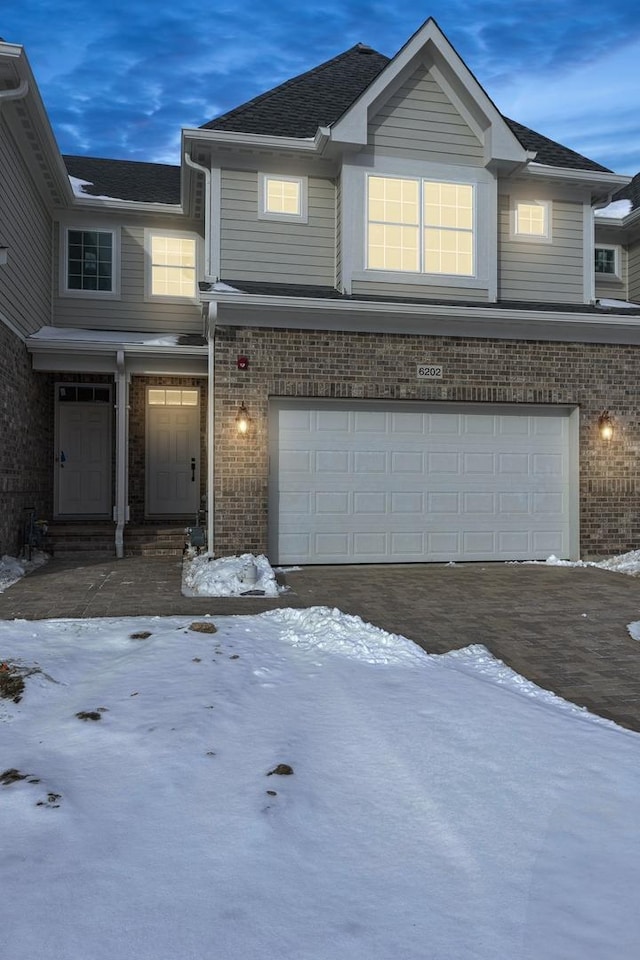 6202 Flagg Creek Ln, Western Springs, IL 60558 - townhome / multi-family property featuring a garage, brick siding, and driveway
