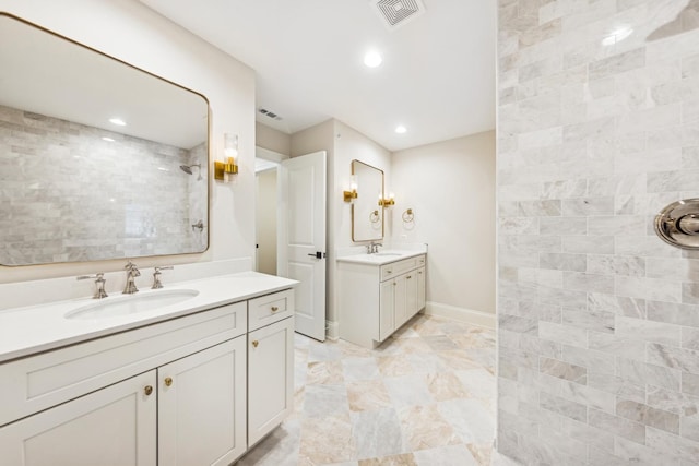 6202 Flagg Creek Ln, Western Springs, IL 60558 - bathroom with a tile shower, two vanities, recessed lighting, and baseboards