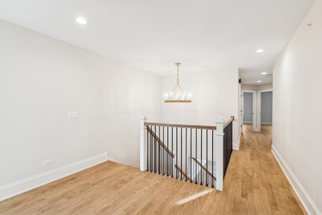 6202 Flagg Creek Ln, Western Springs, IL 60558 - hallway with an upstairs landing, light wood-style floors, a chandelier, recessed lighting, and baseboards