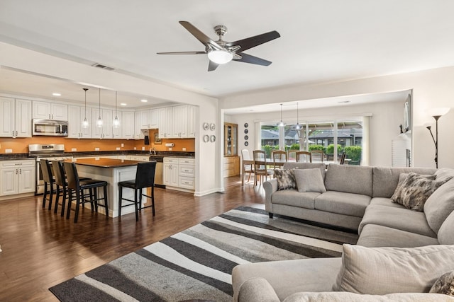 512 N Rose Ave, Park Ridge, IL 60068 - living area with dark wood-type flooring, ceiling fan, and recessed lighting