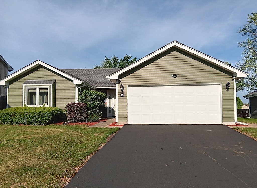 1210 Middlebury Dr, Aurora, IL 60504 - ranch-style house with driveway, a front yard, and a garage