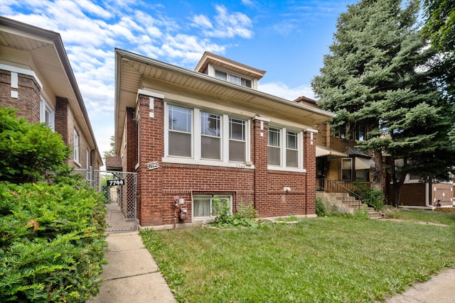 7744 S Laflin St, Chicago, IL 60620 - bungalow featuring brick siding, a gate, and a front yard