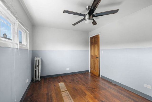 7744 S Laflin St, Chicago, IL 60620 - spare room featuring radiator heating unit, wood finished floors, ceiling fan, and baseboards