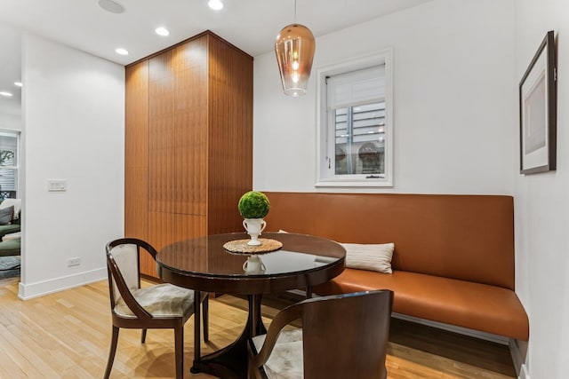dining area featuring light wood-style flooring and recessed lighting