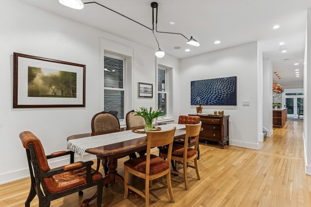 dining room featuring light wood finished floors and recessed lighting