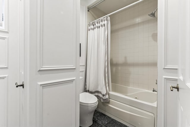 full bathroom with shower / bath combo with shower curtain and tile patterned flooring