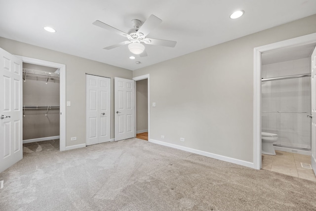 400 Bayview Ave, Naperville, IL 60565 - unfurnished bedroom featuring carpet, baseboards, recessed lighting, connected bathroom, and multiple closets