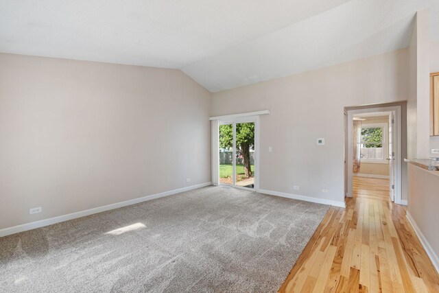 400 Bayview Ave, Naperville, IL 60565 - spare room featuring healthy amount of natural light, lofted ceiling, baseboards, and light wood-style floors